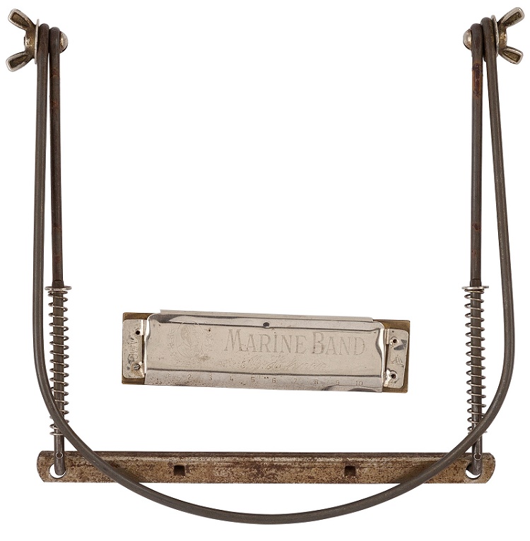 Bob Dylan's harmonica and neckstand from his first paid gigs in New York, circa 1961 