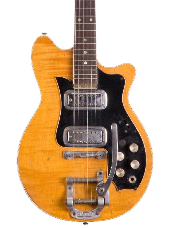 The guitar features a natural flame maple finish, and remains in its original condition