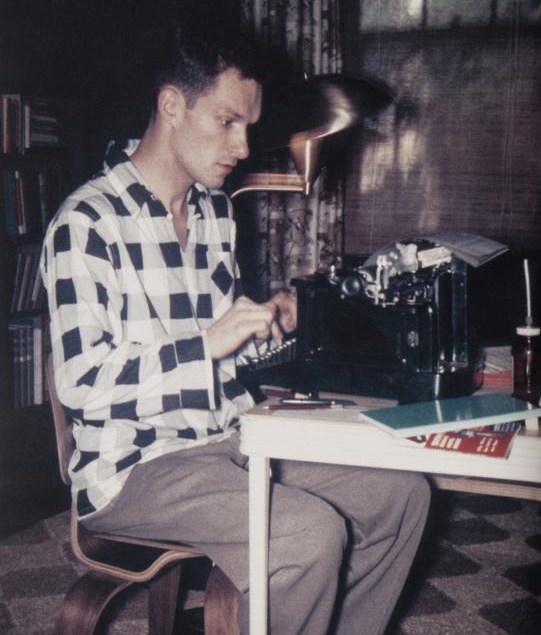 A young Hefner taps away on his Underwood typewriter