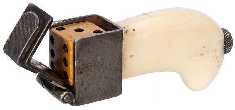 A loaded dice jig, used for drilling holes in dice and adding lead to weigh a particular side down (estimate: $1,000 - $1,500)