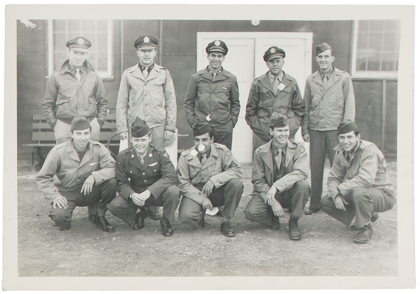 The crew of the B29 bomber Necessary Evil which took part in the bombing of Hiroshima. Lt. Russell E. Gackenbach pictured top row, center