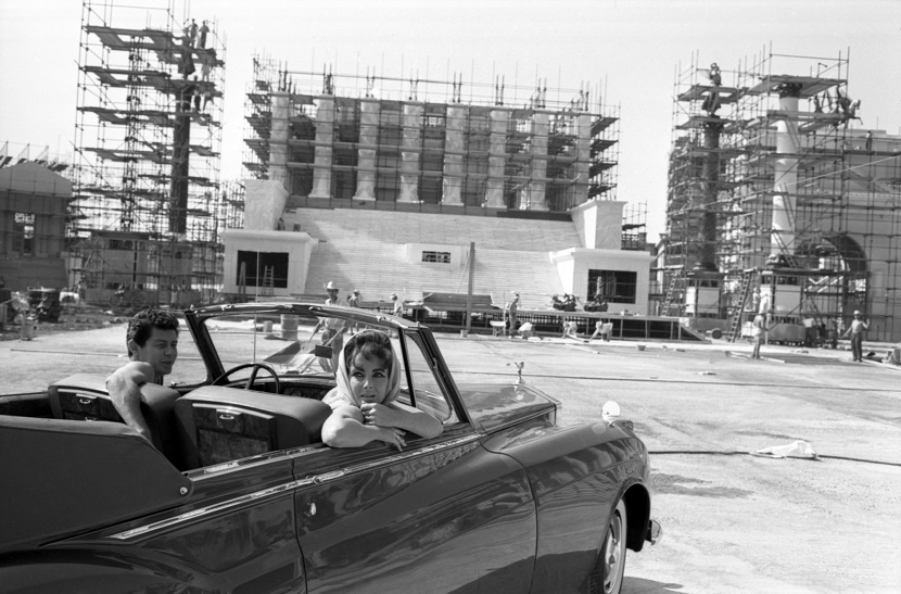 Elizabeth Taylor and Eddie Fisher arrive in the Green Goddess Rolls Royce, during construction of one of Cleopatra's epic sets