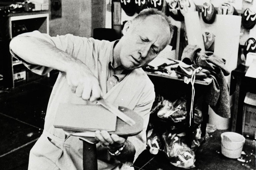 Nike co-founder Bill Bowerman (1911 - 1999), a respected athletics coach who sought to improve performance by designing the ultimate running shoe