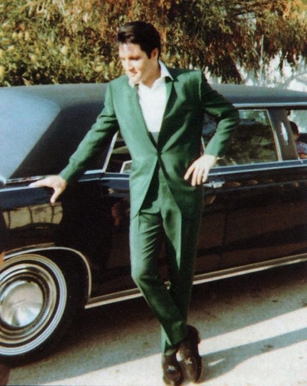 Elvis with his 1967 Lincoln Continental limo.  