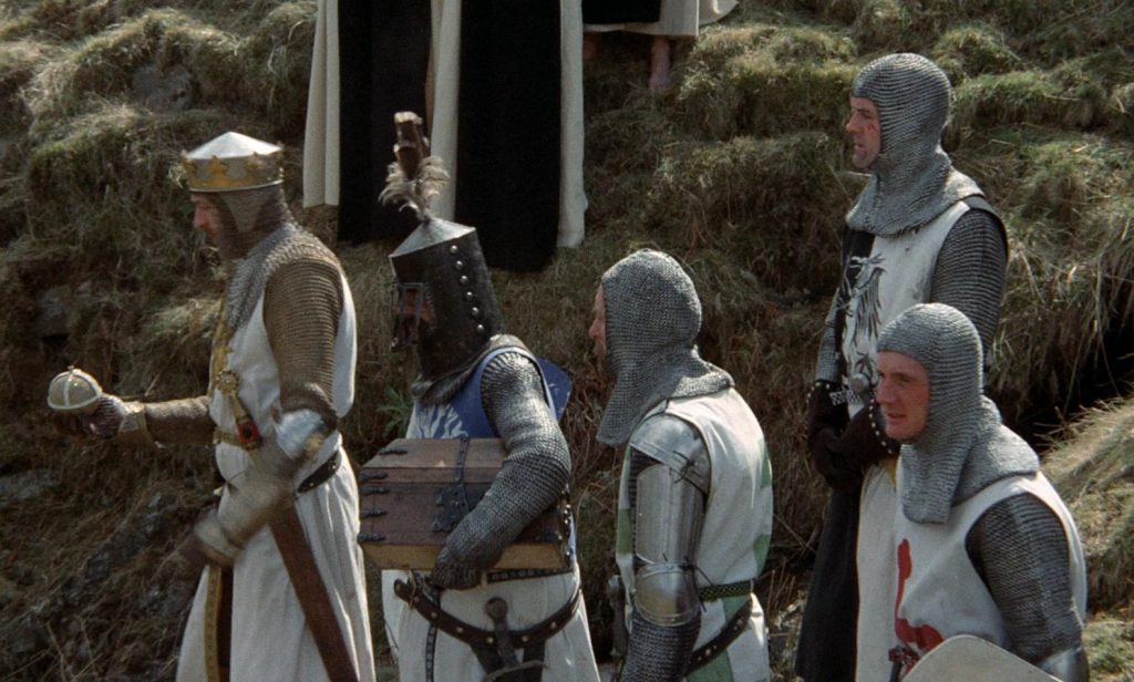 Graham Chapman as King Arthur, preparing to use the sacred armament