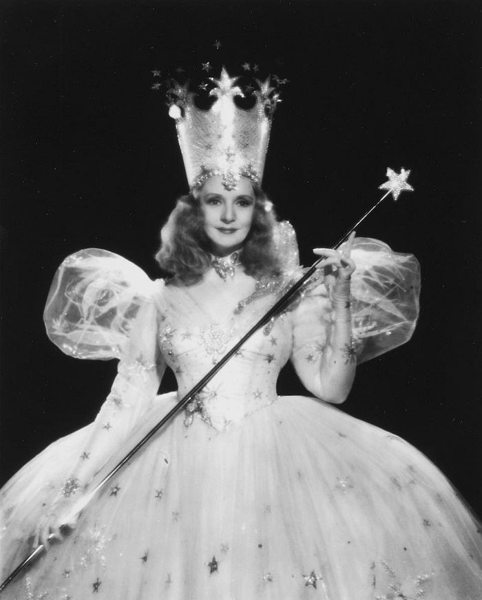 Actress Billie Burke, who played Glinda the Good Witch, holding the wand in a portrait she comissioned from MGM studio photographer Clarence Sinclair Bull (Image: Bonhams)