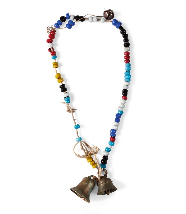 A necklace originally worn by George Harrison, which sold for £10,000 (Image: Sotheby's)