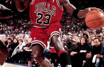 Michael Jordan playing basketball in his famous 23 Chicago Bulls shirt