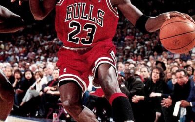 Michael Jordan playing basketball in his famous 23 Chicago Bulls shirt