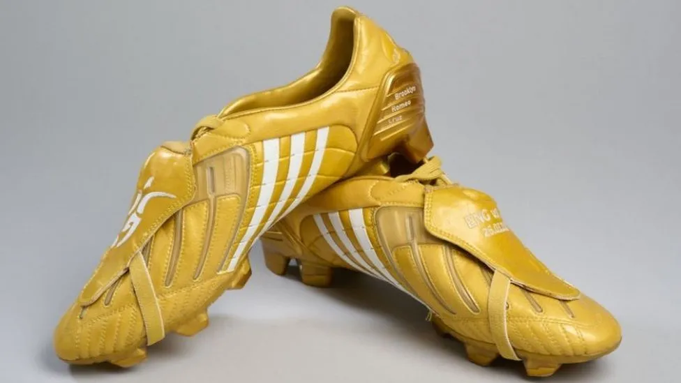 A pair of golden boots worn by David Beckham for his 100th England cap