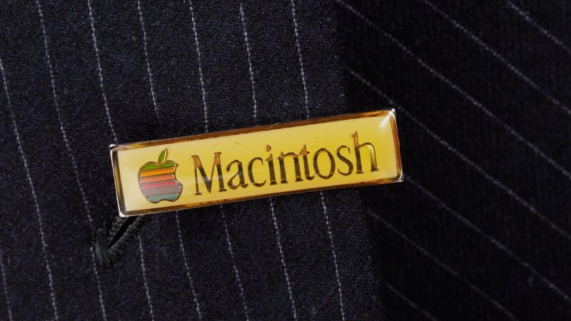 An Apple Macintosh pin badge once worn by Steve Jobs.