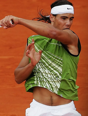 Rafael Nadal in a Nike, green sleeveless t-shirt