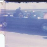 still image from footage of the John F Kennedy motorcade on the day of his assassination