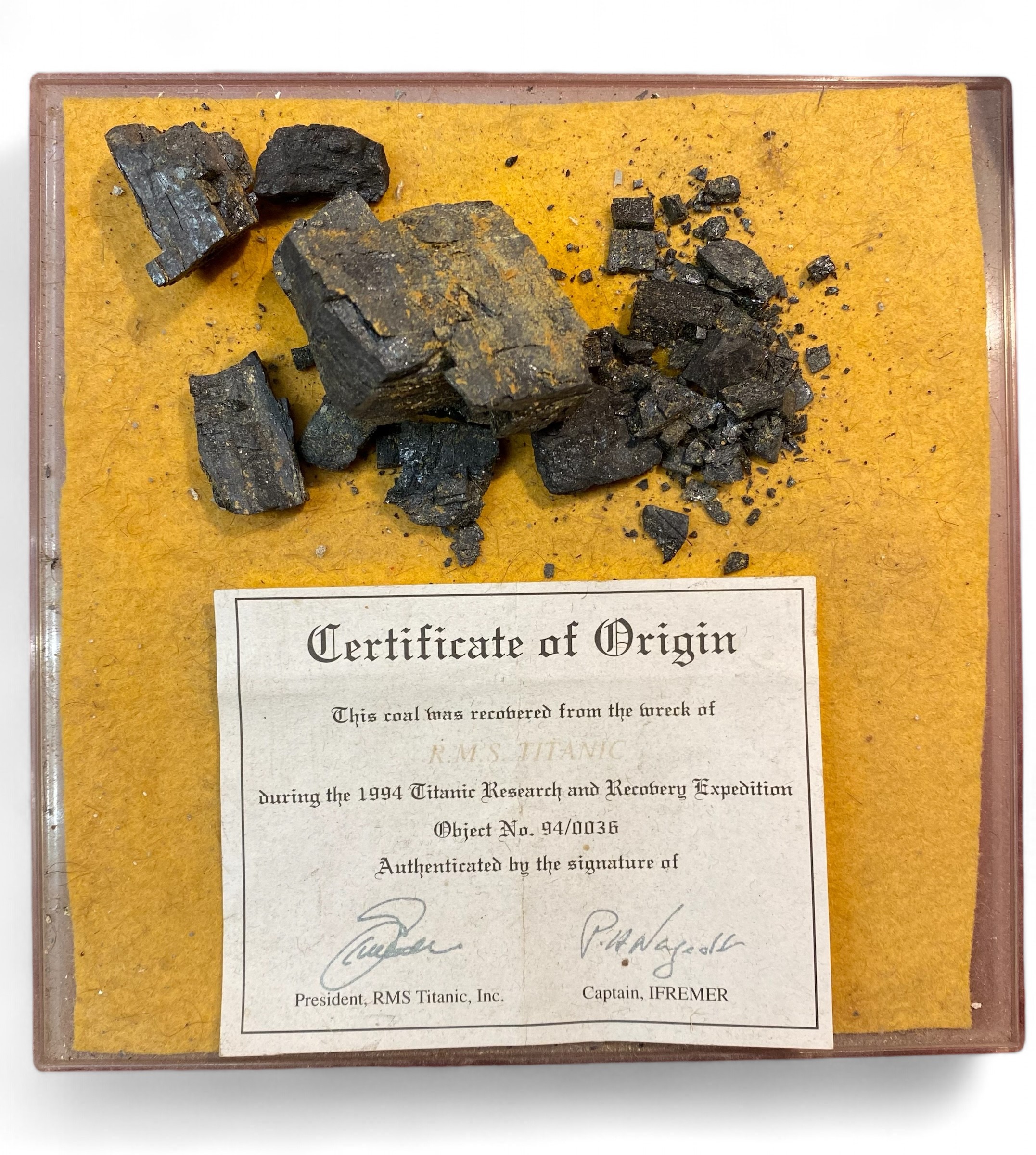 Coal from the Titanic on a card with a certificate of authenticity.