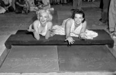 Marilyn Monroe and Jane Russell leave hand and footprints in the Hollywood Walk of Fame.