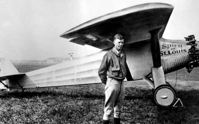 Charles Lindbergh in front of the Spirit of St Louis.