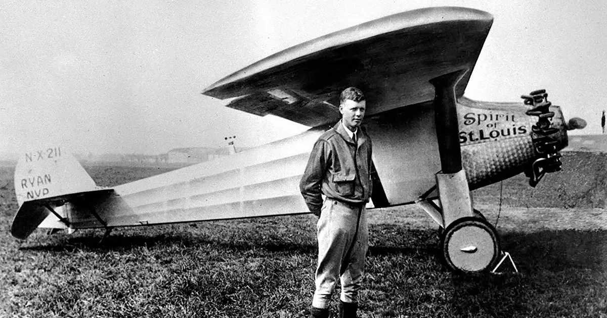 Charles Lindbergh in front of the Spirit of St Louis.