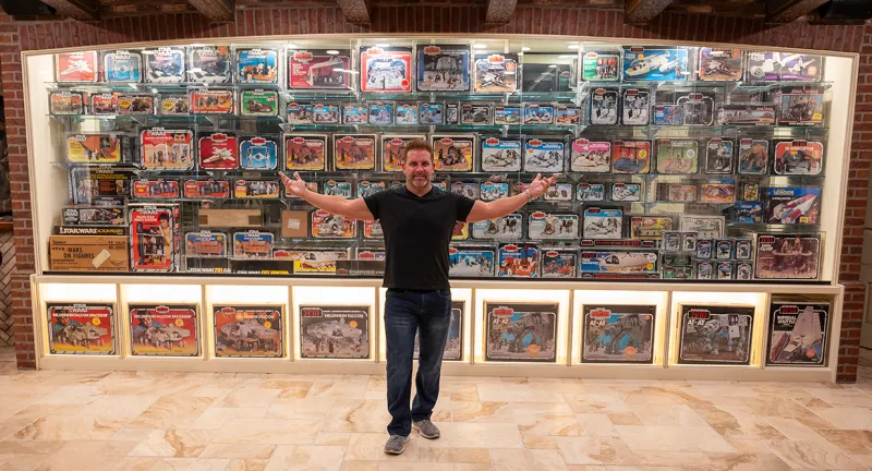 Jeff Jacobs with his action figure collection