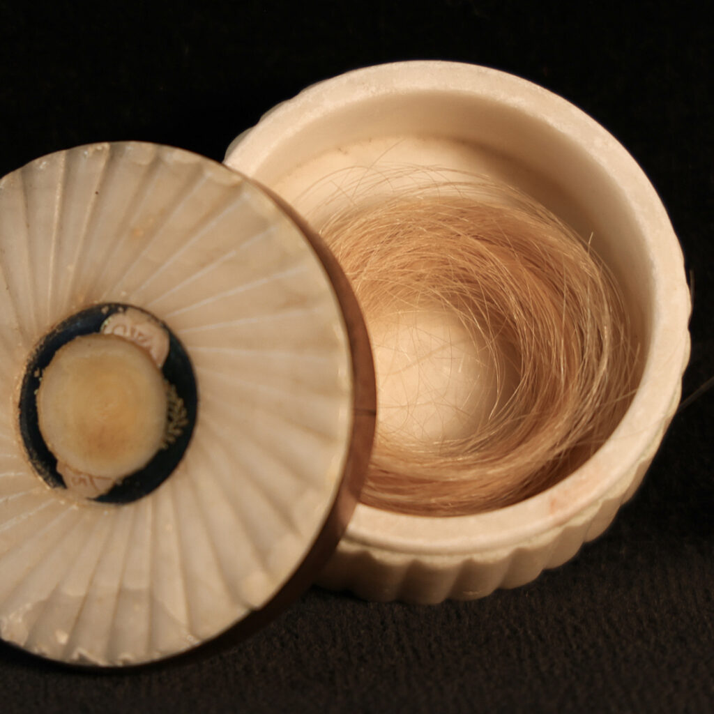 A box containing a large lock of the hair of Admiral Lord Nelson. 