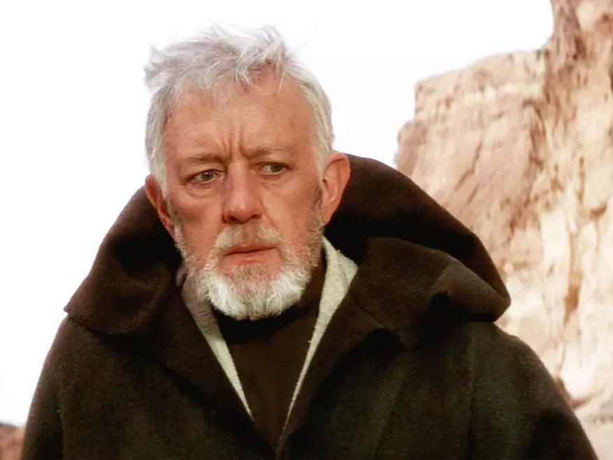 Alec Guinness as Obi-Wan Kenobi.