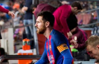 Lionel Messi ascends to the pitch at Barcelona Camp Nou stadium.