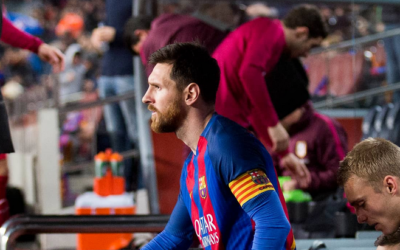 Lionel Messi ascends to the pitch at Barcelona Camp Nou stadium.