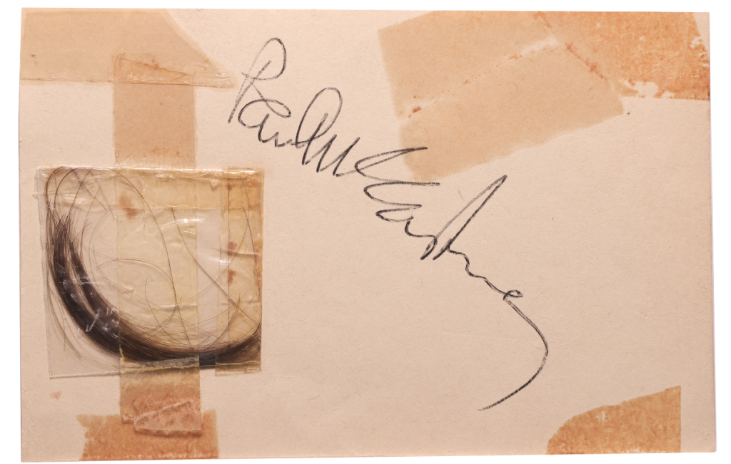 Paul McCartney signature with lock of McCartney's hair. 