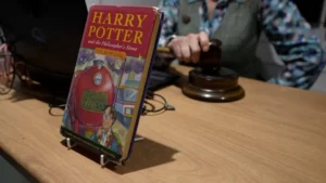 Harry Potter and the Philosopher's Stone Book propped on table