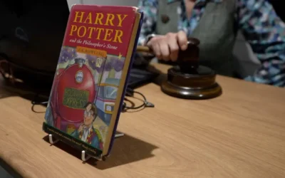 Harry Potter and the Philosopher's Stone Book propped on table