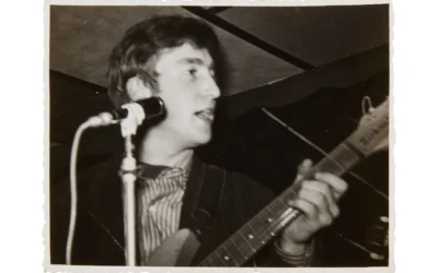 John Lennon performing with the Beatles in the Casbah Club, Hamburg in 1961.