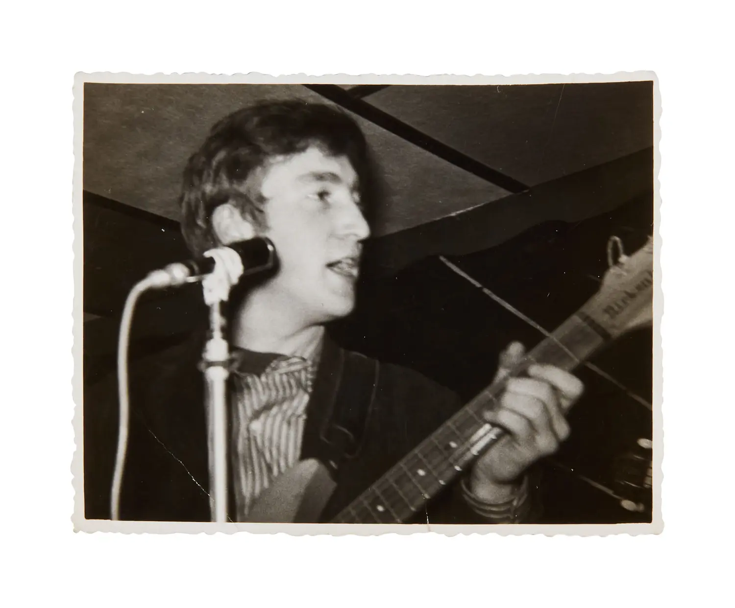 John Lennon performing with the Beatles in the Casbah Club, Hamburg in 1961.