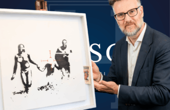Charles Hanson of Hansons Auctioneers with Family Target by Banksy.