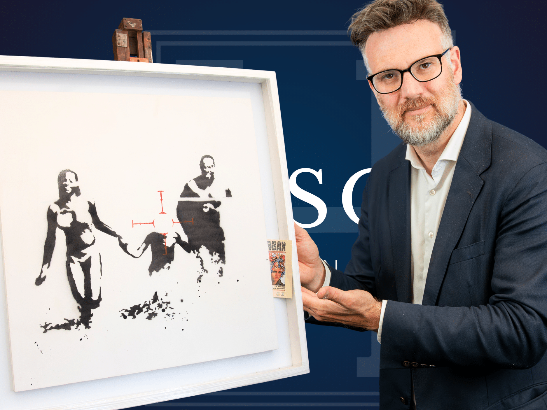 Charles Hanson of Hansons Auctioneers with Family Target by Banksy.