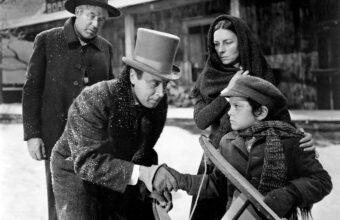 Still from Citizen Kane showing young Charles Foster Kane with Rosebud his sled and Thatcher, his guardian and banker.