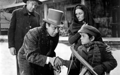 Still from Citizen Kane showing young Charles Foster Kane with Rosebud his sled and Thatcher, his guardian and banker.