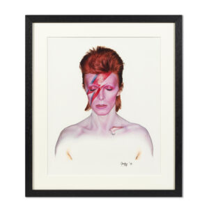 Framed copy of the portrait of David Bowie with lightning bolt makeup from the cover of Aladdin Sane fro 1973.