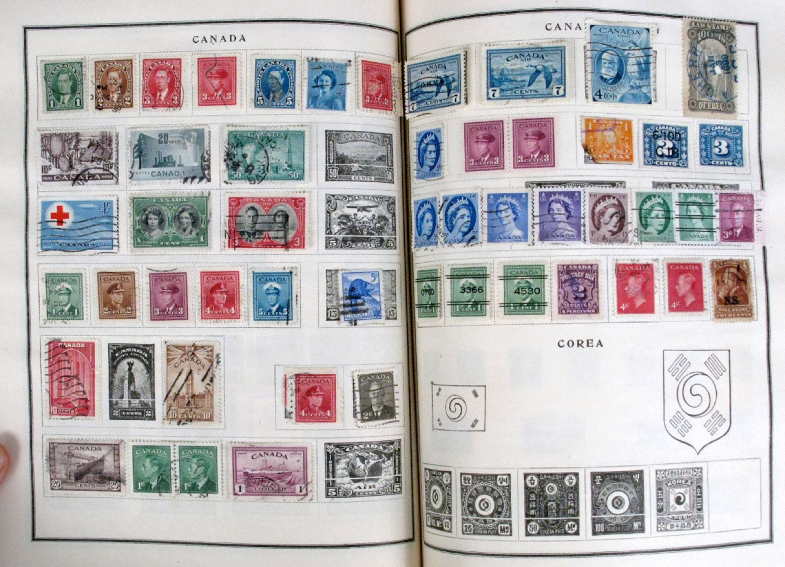 A stamp collection mounted across album pages