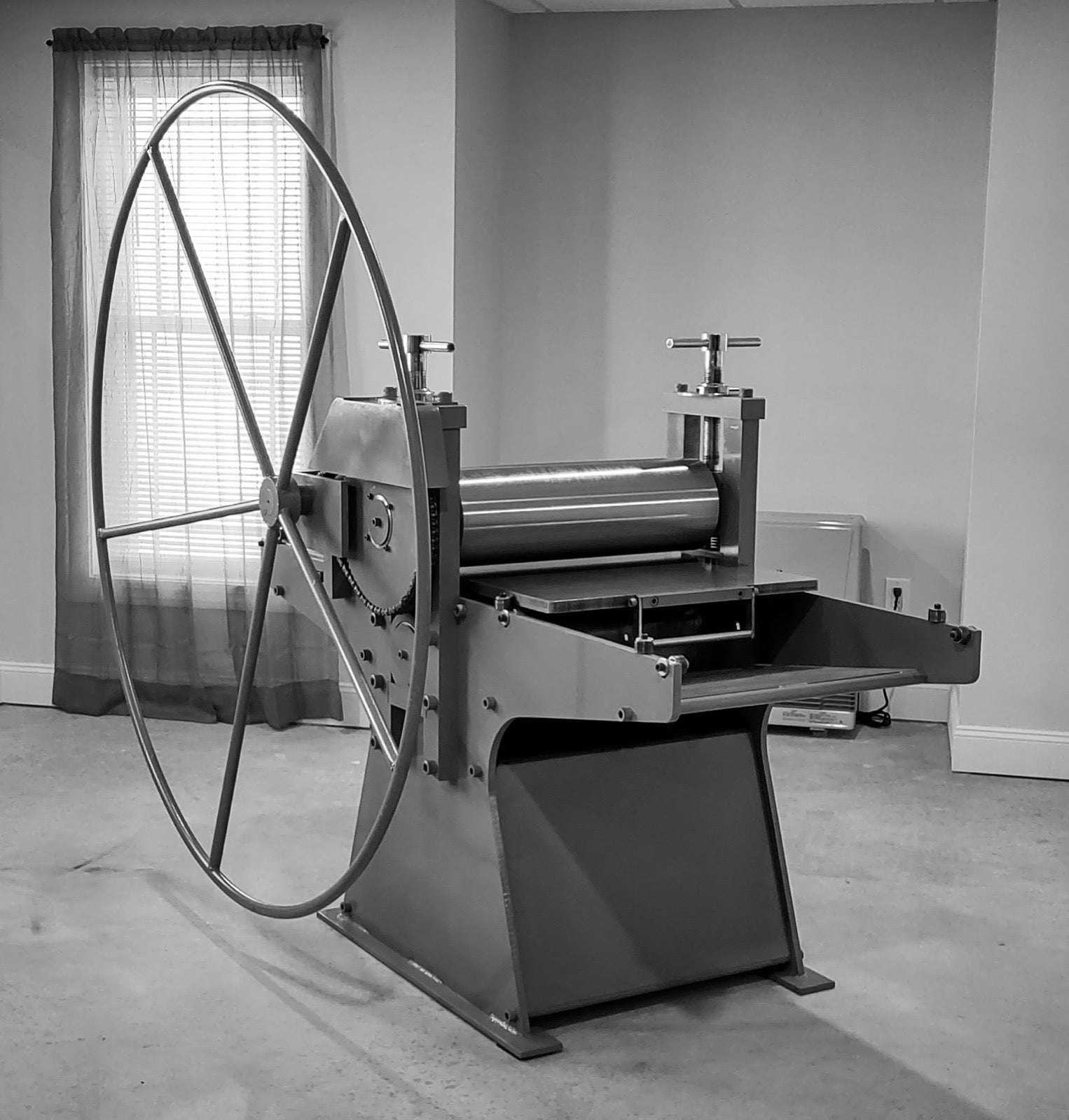 A traditional etching press, the tool used to print an etched plate