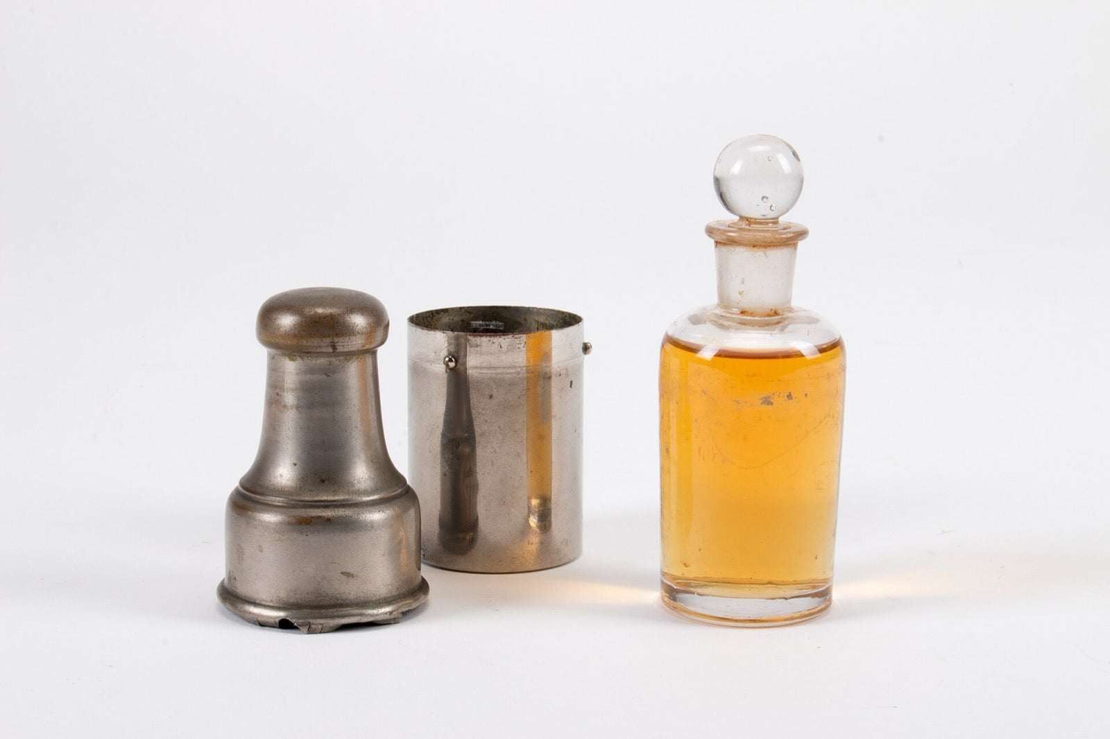 Antique whisky decanter with silver travelling case
