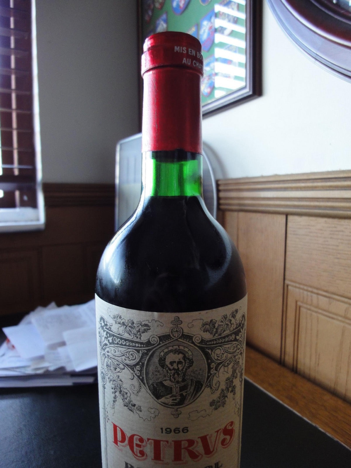 Ullage level visible on a 1966 Petrus bottle