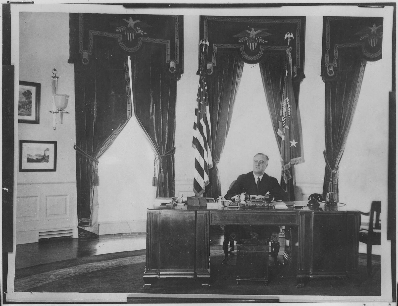 Roosevelt at his desk in the Oval Office
