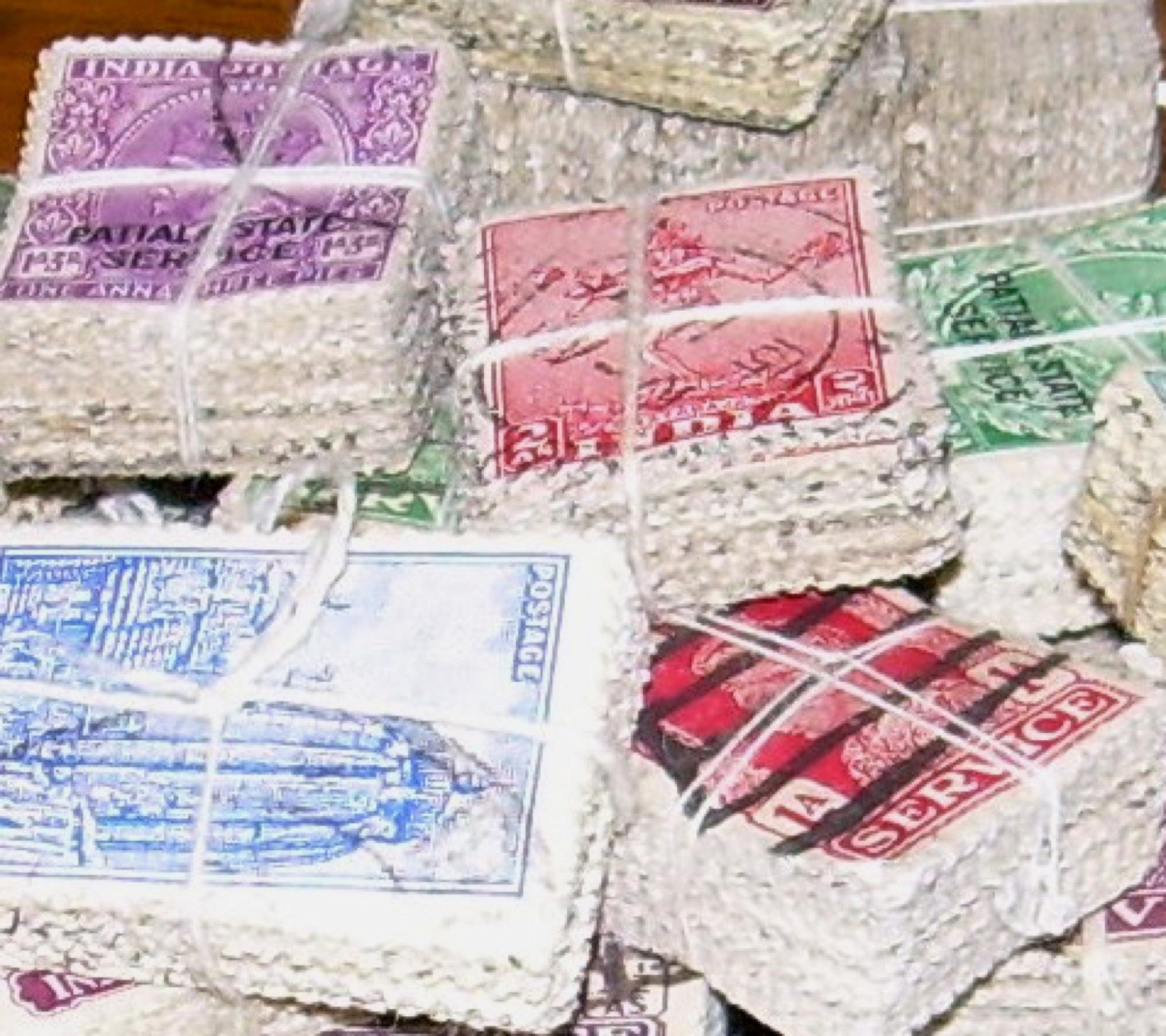 Loose used postage stamps ready for sorting