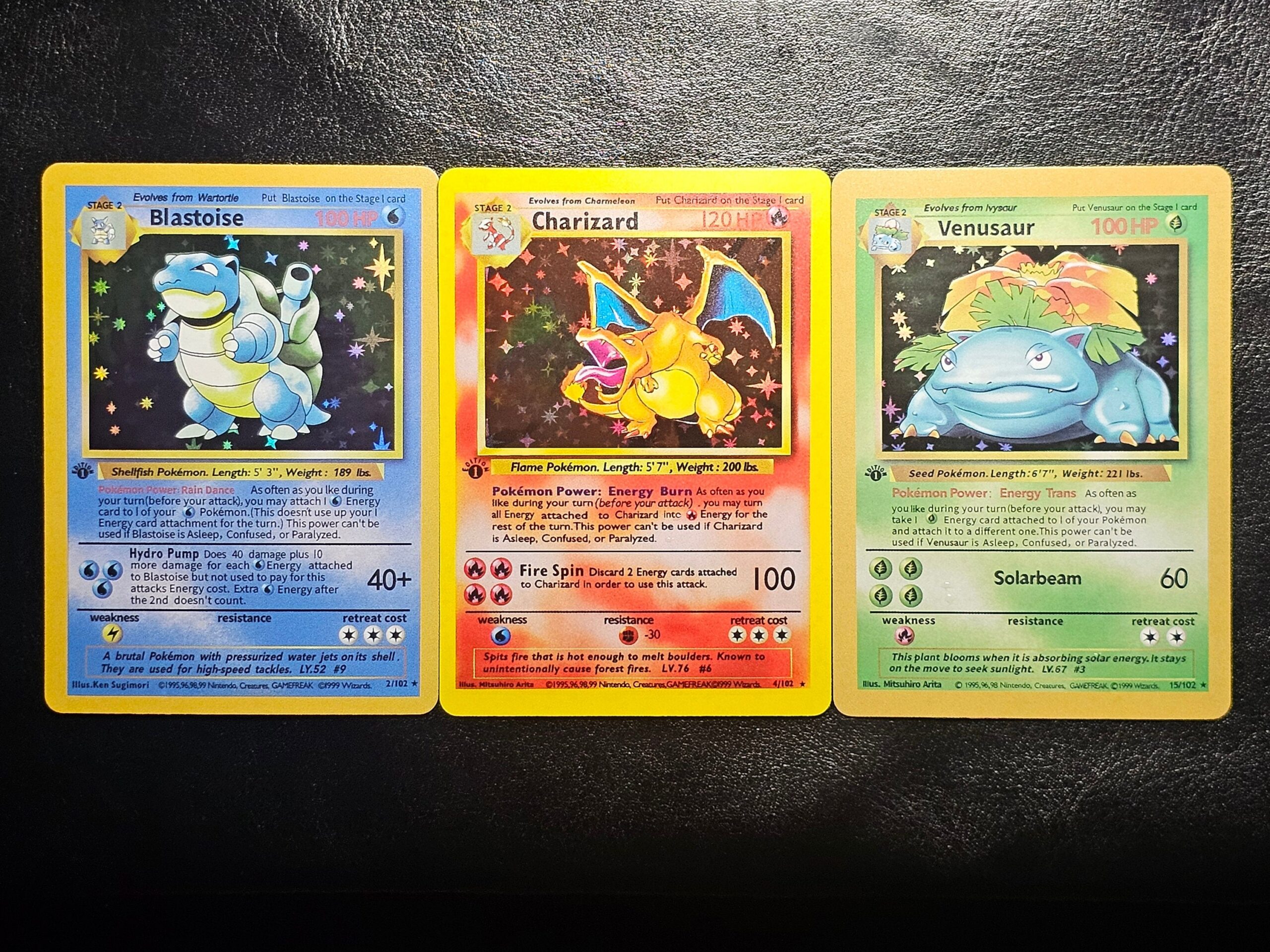 1999 1st edition holographic Blastoise and Venusaur Pokémon trading cards