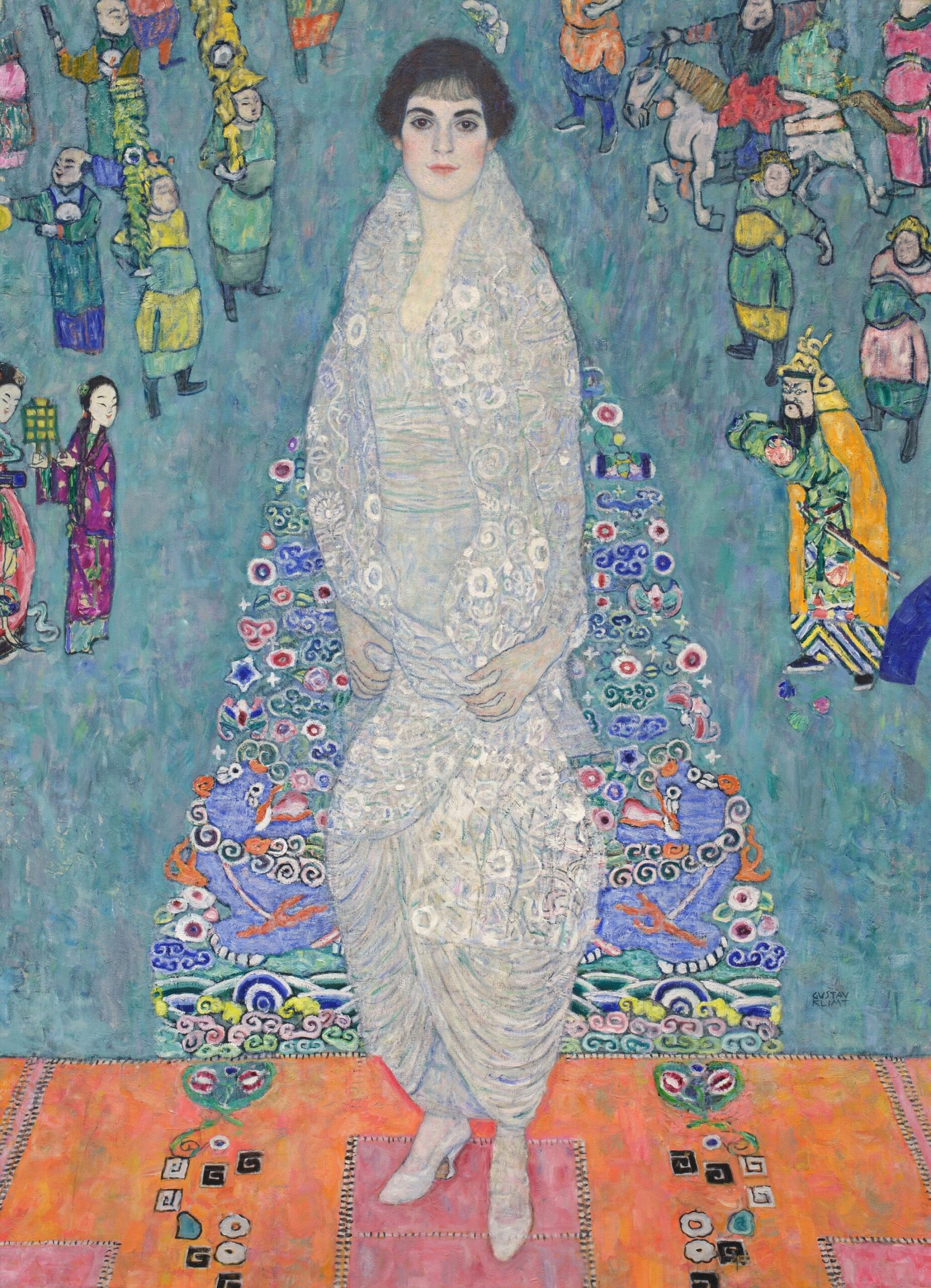 Elisabeth Lederer stands full-length in a white imperial robe patterned with dragons, set against a tapestry of soldiers and celestial motifs. She was twenty when Klimt began the portrait, the daughter of the family who were his most important patrons.