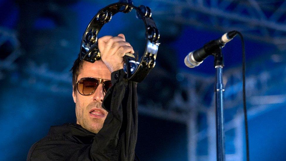Stage-played tambourine and signature clothing associated with Liam Gallagher