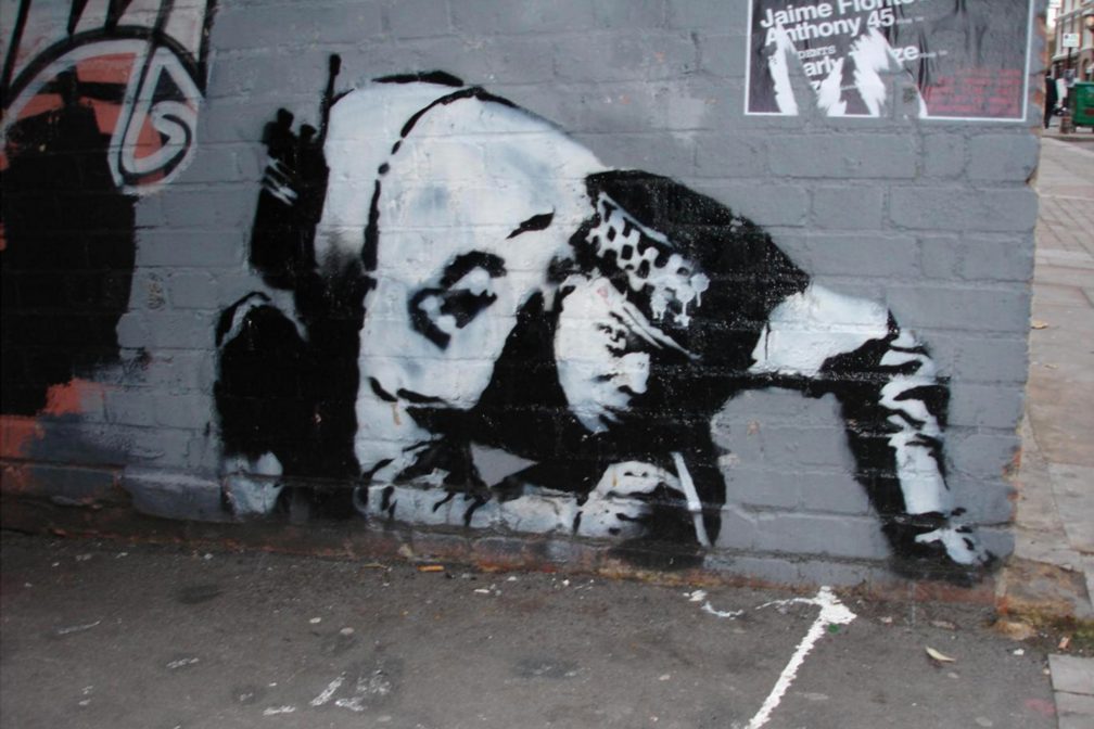 Banksy: Snorting Copper Snorting Copper, stenciled graffiti by Banksy on Curtain Road, in Shoreditch, London, c. 2005; it was later covered over.