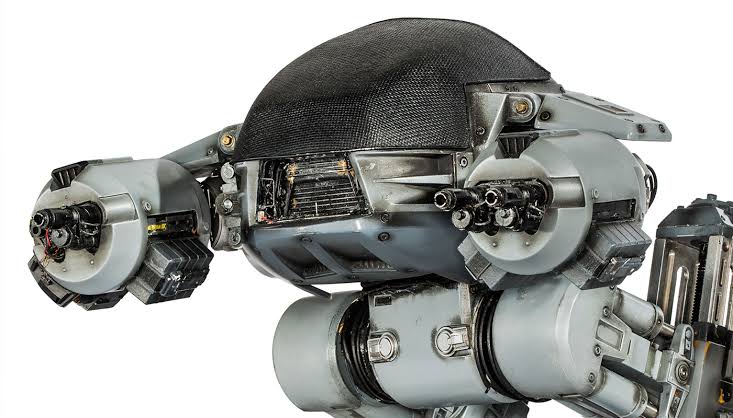 The upper torso and weapon arms of a full-scale ED-209 law enforcement droid prop from RoboCop.