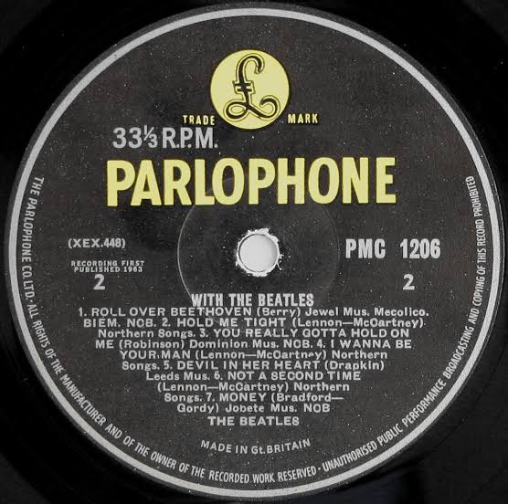 With The Beatles vinyl record label displaying the Jobete publishing credit misprint