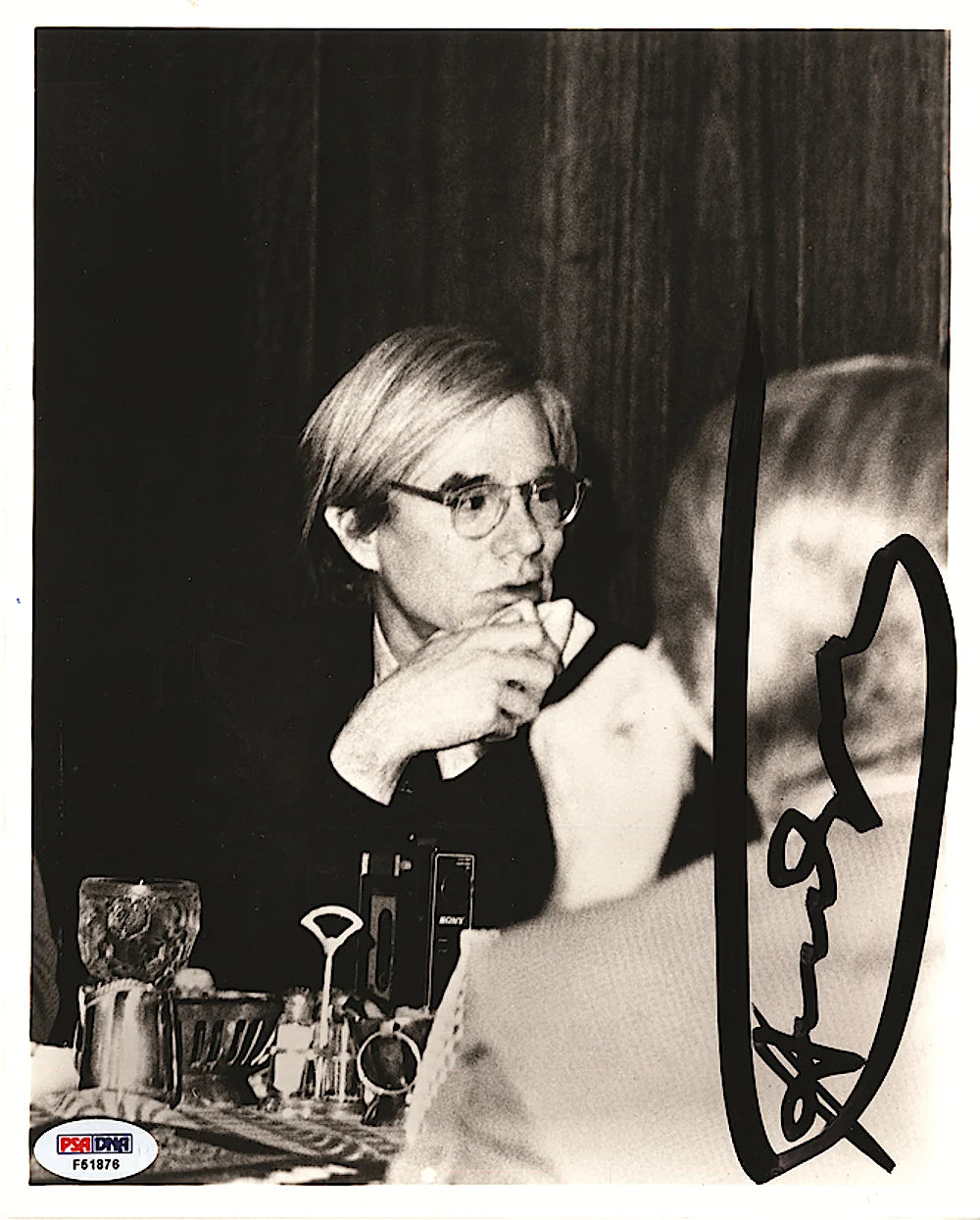 Andy Warhol signed photograph at a dinner table